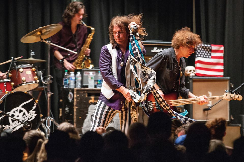 Neill Byrnes and members of Aerosmith tribute band Draw The Line, onstage at the Sherburne Gymnasium in Sunapee, New Hampshire.
